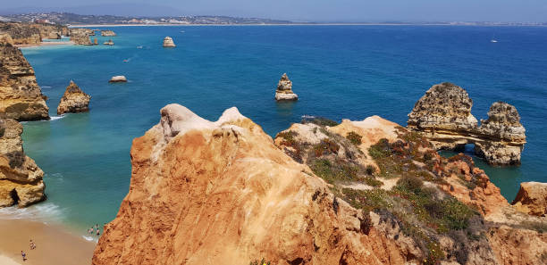 istock Beautiful landscape: cliffs in turquoise Atlantic ocean near Lagos, Portugal 1160820189