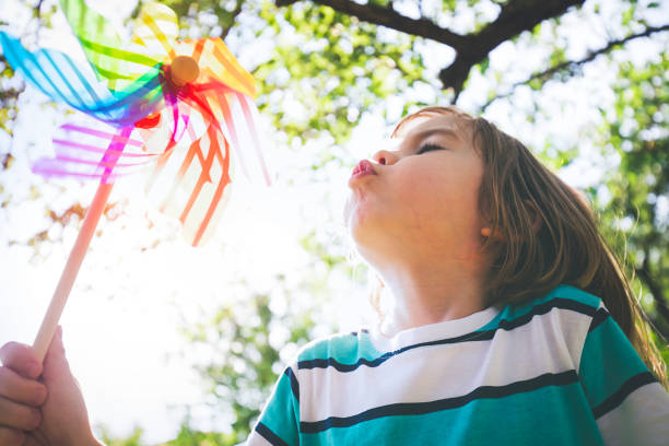 istock Child with pinwheel toy 1160823601