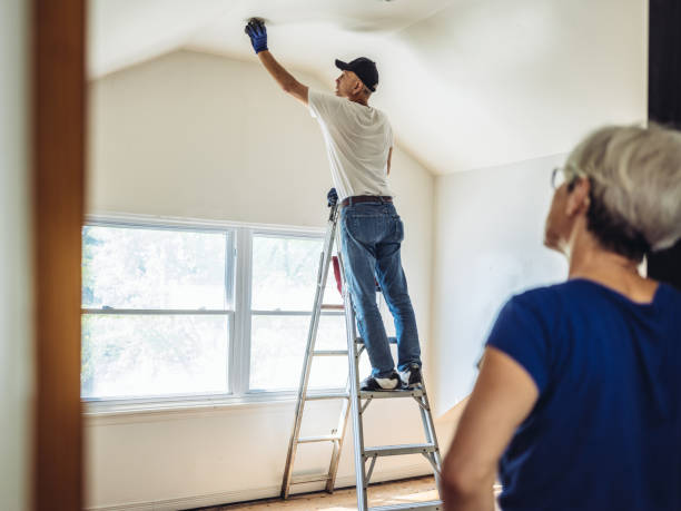 istock Senior man painting apartment interior 1160823917