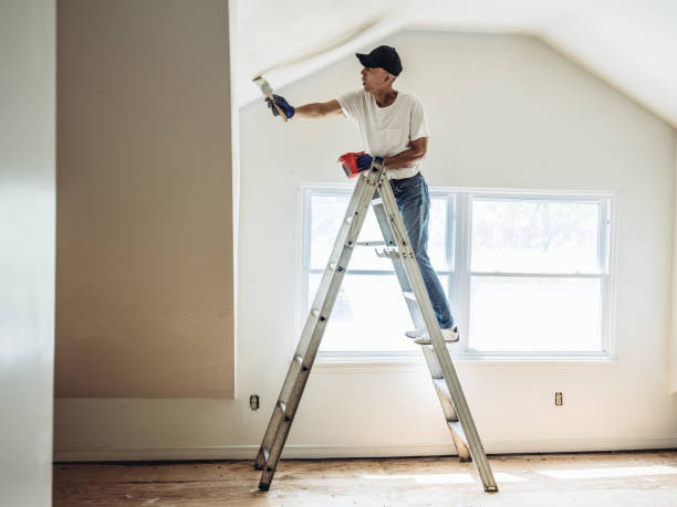 istock Senior man painting apartment interior 1160824850