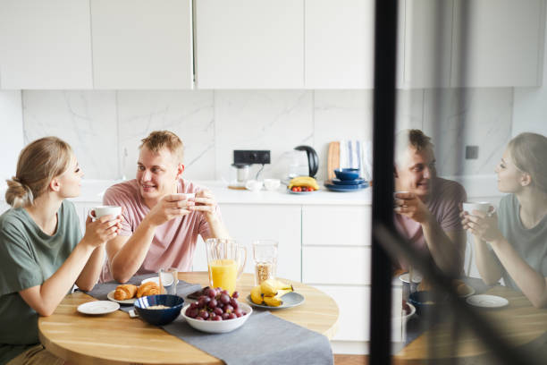 istock Young restful spouses having brunch and tea in the kitchen 1160827220