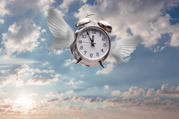 istock Times flies concept with wings on alarm clock in sky 1160827420