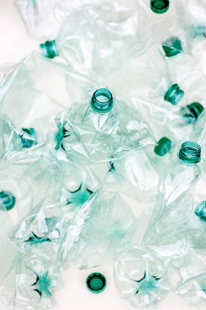 heap of empty crumpled plastic bottles on a white background - tailings container environment pollution imagens e fotografias de stock