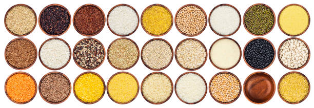 istock Different cereals, grains and flakes isolated on white background with clipping path, top view 1160832019
