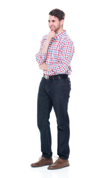 istock Attractive young man wearing a checked shirt and jeans - is thinking 1160832172