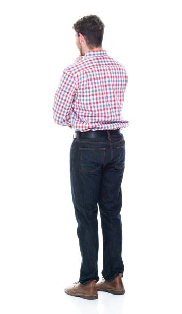 istock Attractive young man wearing a checked shirt and jeans - is thinking 1160832187