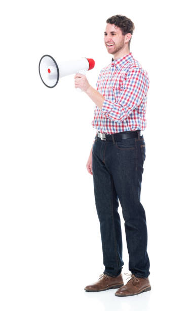 istock Attractive young man wearing a checked shirt and jeans - using a megaphone 1160832264