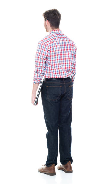 istock Attractive young man wearing a checked shirt and jeans - using a laptop 1160832294