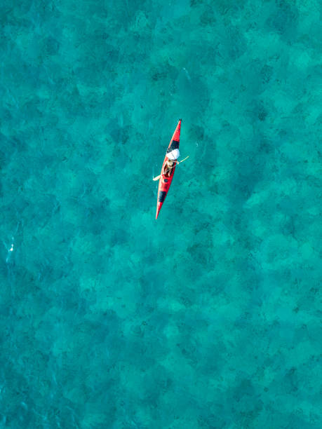 istock Woman paddling a kayak from above 1160833813