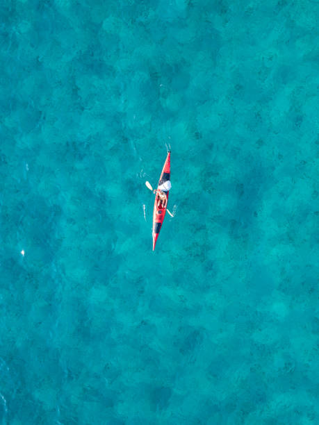istock Woman paddling a kayak from above 1160833825