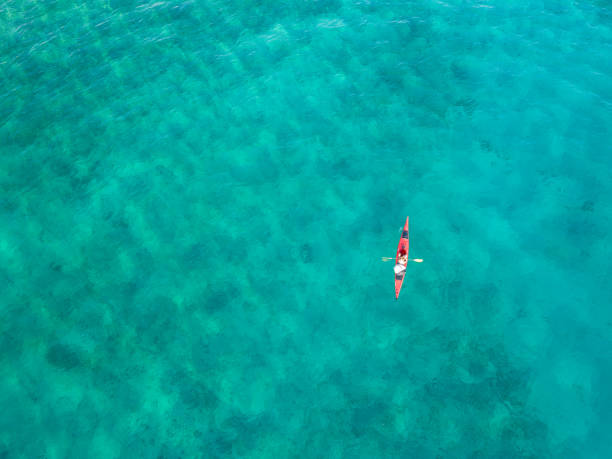 istock Woman paddling a kayak from above 1160833845