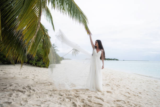 istock The bride throws a white dress in the air. 1160835244