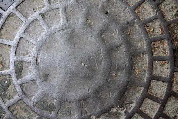 a old worn down manhole cover