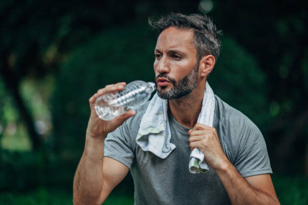 istock Man resting after running in nature 1160835559