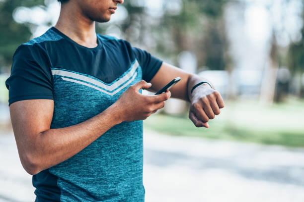 istock Male athlete with smart phone 1160835689