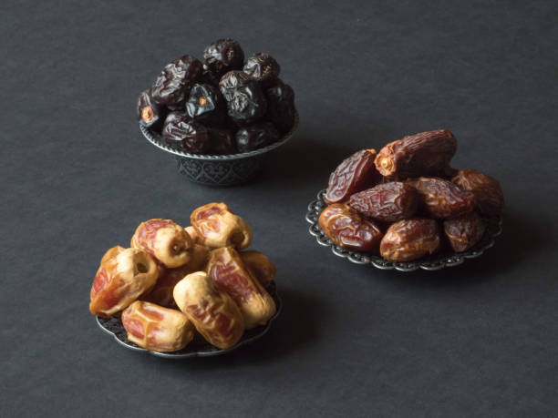 istock Arabic dates fruits are laid out on a dark table 1160835763