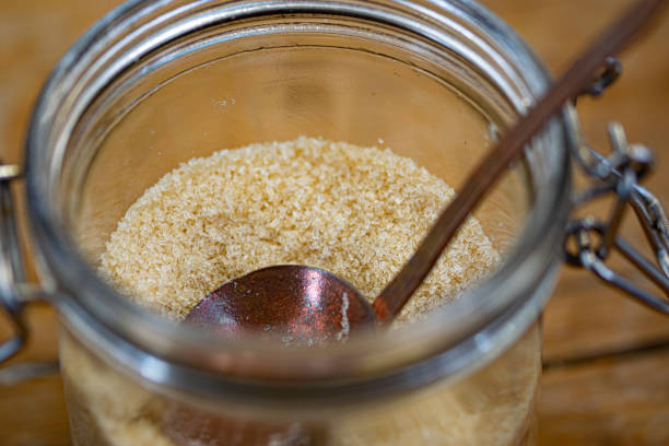 istock Glass jar with brown sugar. 1160835924