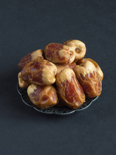 istock Saudi dates Sagai are laid out on a black table 1160836731