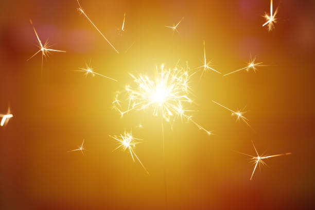 istock Sparks from hand cold fireworks color background 1160838704