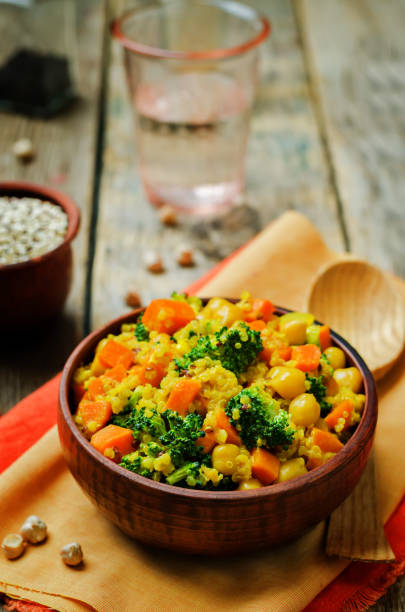 istock Quinoa broccoli carrot curry on a wood background 1160839118
