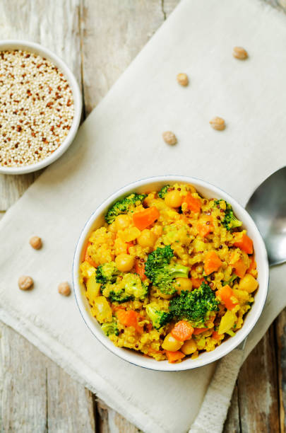 istock Quinoa broccoli carrot curry on a wood background 1160839122