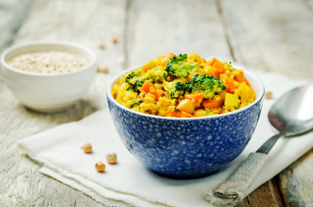 istock Quinoa broccoli carrot curry on a wood background 1160839144
