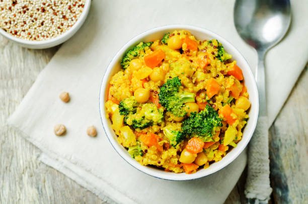 istock Quinoa broccoli carrot curry on a wood background 1160839146