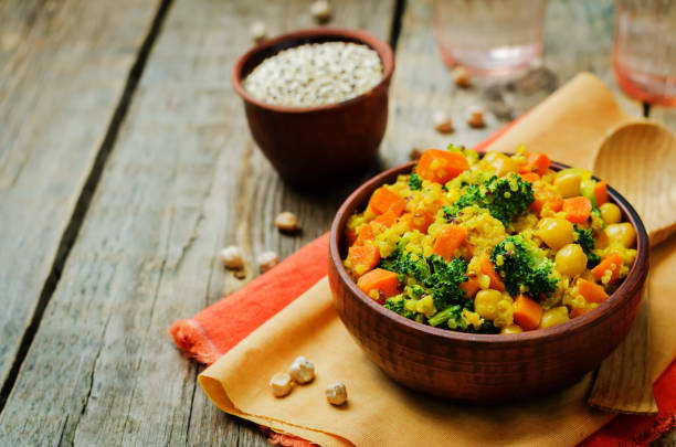 istock Quinoa broccoli carrot curry on a wood background 1160839172