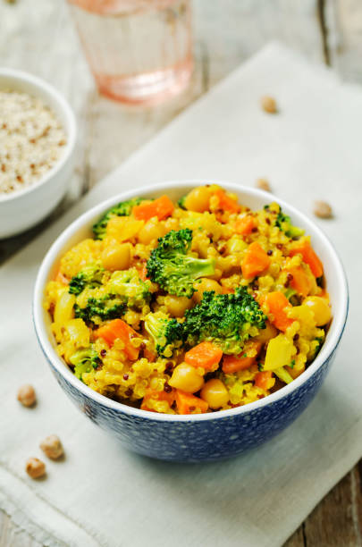 istock Quinoa broccoli carrot curry on a wood background 1160839176
