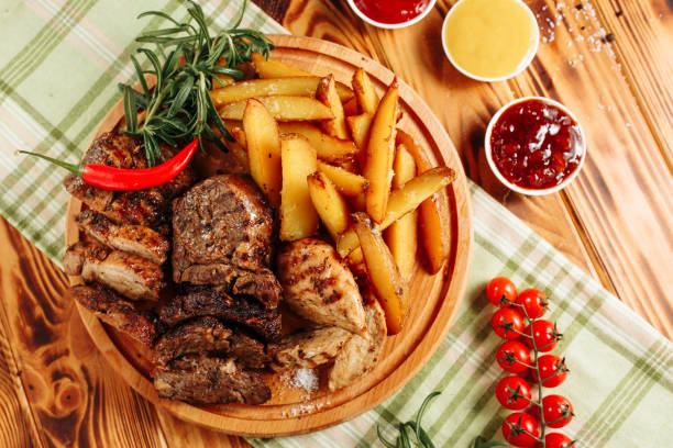 Red pepper on a plate with meat. Delicious dinner. Food on the plate. Pepper and meat.
