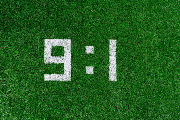 istock Football score 9:1.White numbers nine and one are drawn on the green grass,creative scoreboard 1160841497