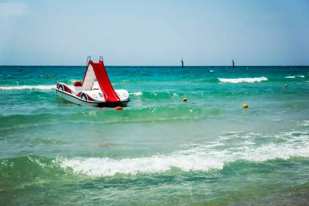 One pedal-boats with water slides on the beach in Halkidiki, Greece.