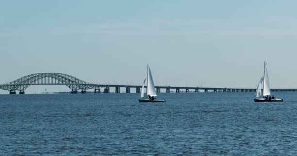 istock Small sailboat with bridge in the background 1160847892