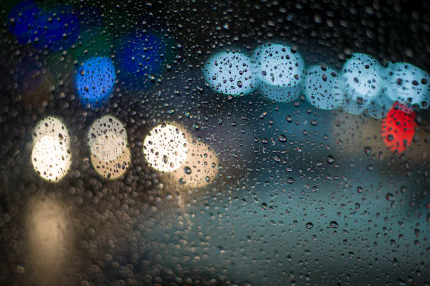istock Wet glass surface with bokeh 1160847994