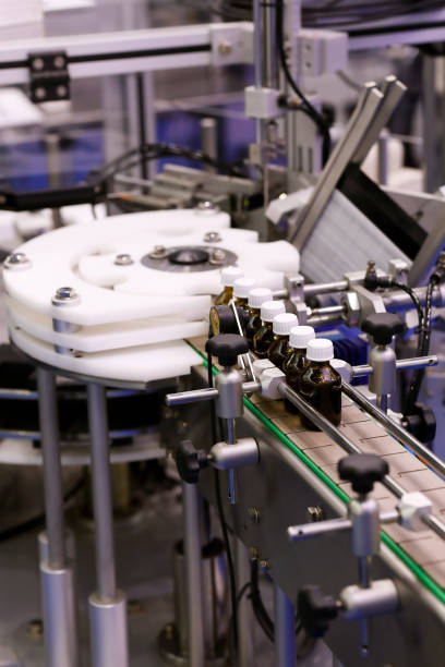 istock small glass medicine bottles on a packaging line 1160848067