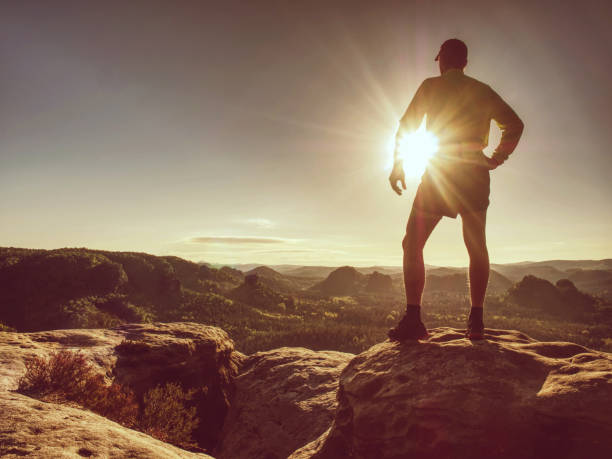 istock Silhouette of athlete runner on sunset background copy space. 1160848895