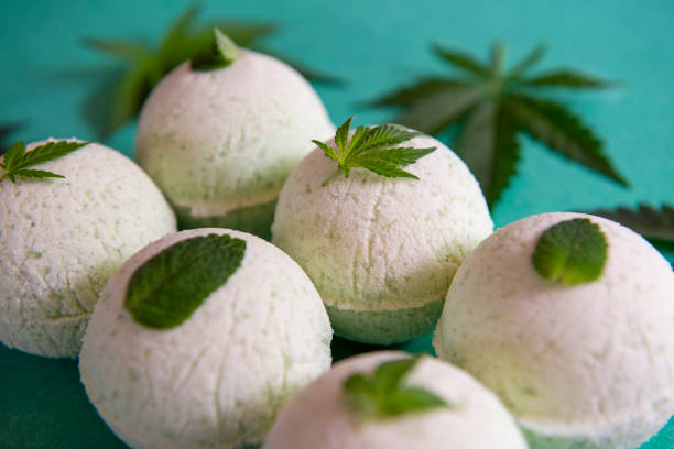 istock Cannabis bath bombs with marijuana and mint leaves 1160853148