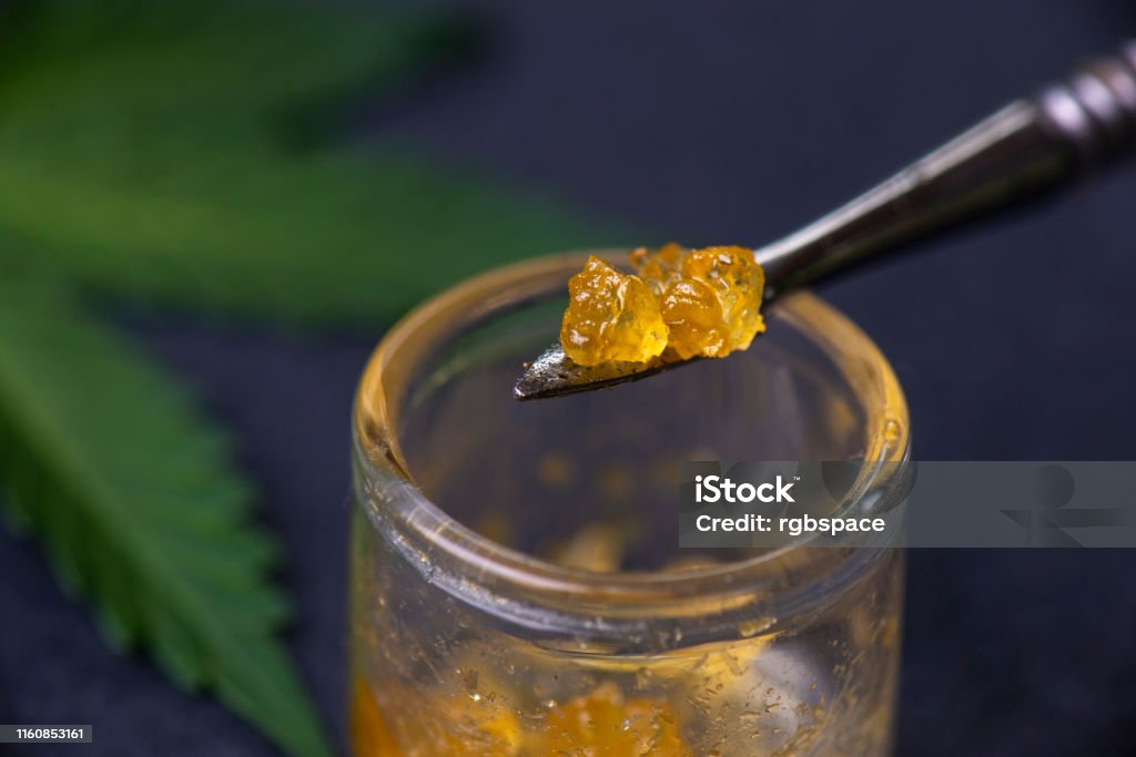 Macro detail of cannabis concentrate live resin extracted from medical marijuana on a dabbing tool Concentration Stock Photo