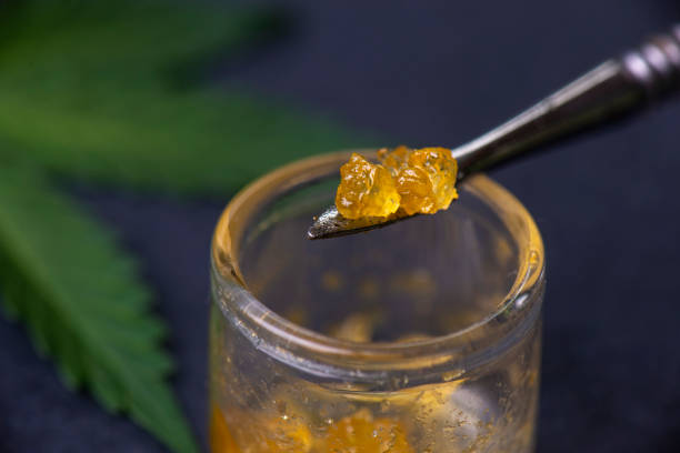 Macro detail of cannabis concentrate live resin extracted from medical marijuana on a dabbing tool - fotografia de stock