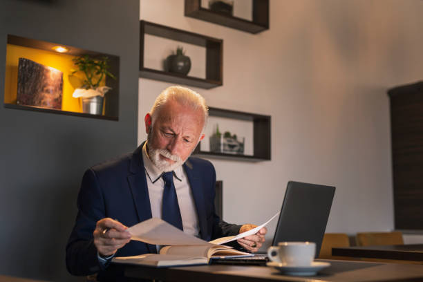istock Senior businessman reading a contract 1160854618