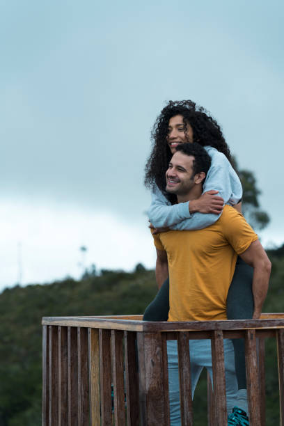 istock Couple embraced on a balcony after trekking 1160859077