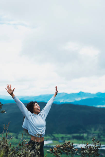 istock Woman in nature with open arms 1160859123