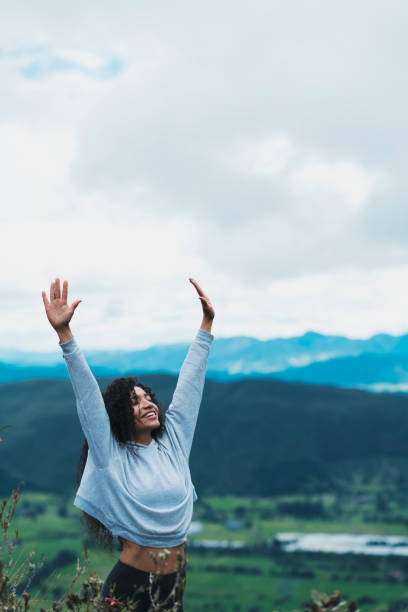 istock Woman in nature with open arms 1160859136