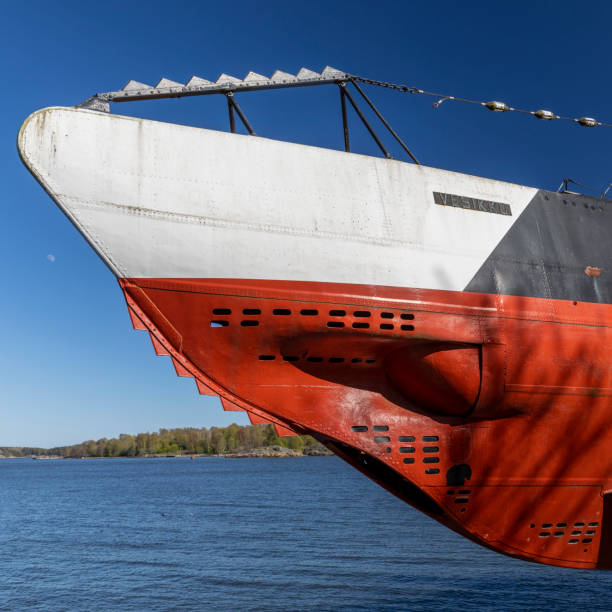 Ducks swim on the background of the engine of the Russian submarine. Rowing propellers sea ship.