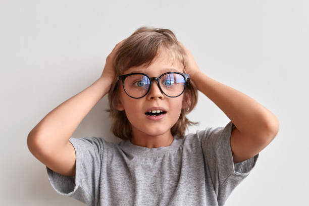 istock Shocked schoolboy looking away 1160866384