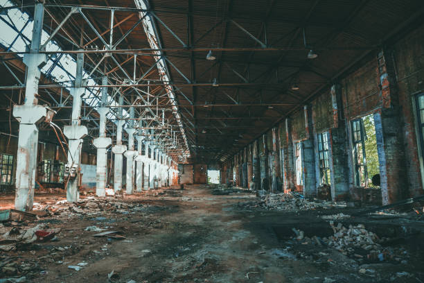 istock Dramatic ruined and abandoned industrial building, creepy corridor view, perspective 1160867184
