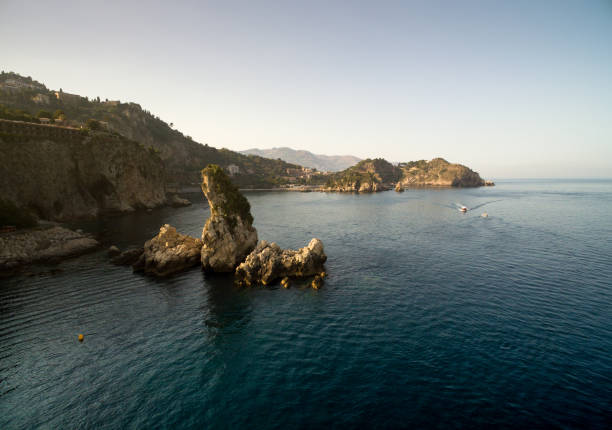 Aerial view of Faraglioni rocks in Capri island, Italy Aerial view of Faraglioni rocks in Capri island, Italy isola bella taormina stock pictures, royalty-free photos & images