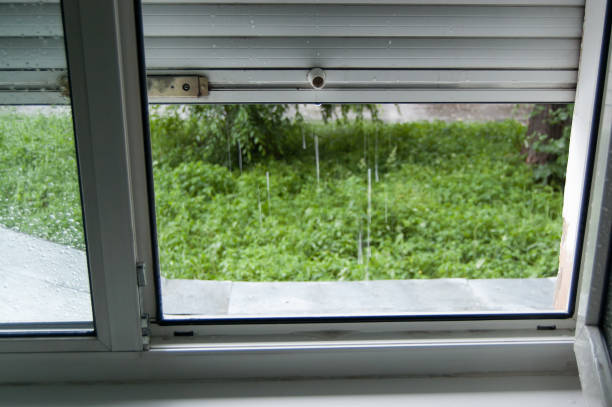 istock view from the window with shutters to outside where it is raining 1160875770