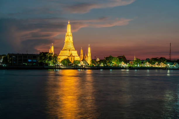 istock Wat Arun, Buddhist temple at  Chao Phraya river side in evening, Bangkok, Thailand. 1160880246