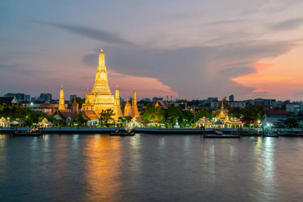 istock Wat Arun, Buddhist temple at  Chao Phraya river side in evening, Bangkok, Thailand. 1160880492
